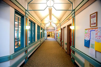 Brightly lit hallway in a senior living facility