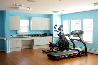 Fitness equipment in a bright exercise room
