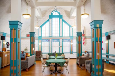 Bright common area with seating and natural light