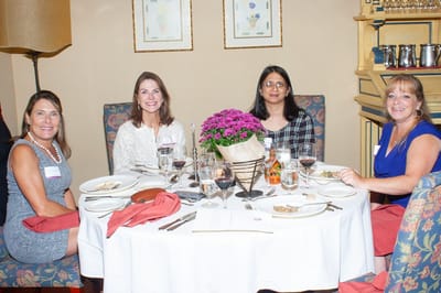 Residents enjoying a meal together in the dining area