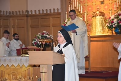 Religious ceremony with participants at the altar.