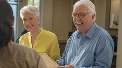 Residents engaging in a cheerful activity indoors
