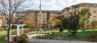 Outdoor view of the assisted living facility with gardens
