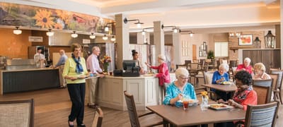 Residents enjoying a meal in a dining room