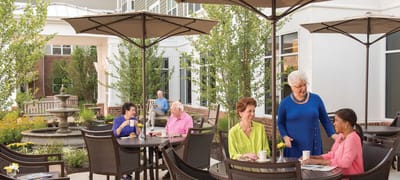 Residents enjoying the outdoor patio area