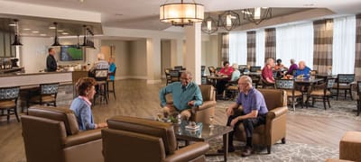 Residents socializing in a common area lounge
