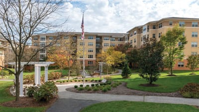 Exterior view of the assisted living facility with garden