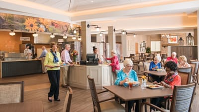 Residents enjoying a meal in the dining room