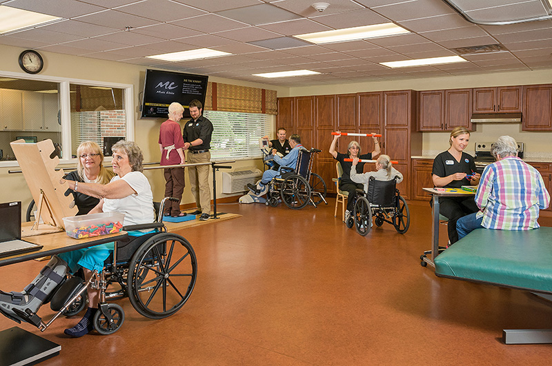 Residents participating in art therapy activities in a common room