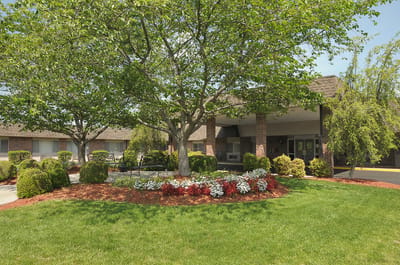 Exterior view of the facility with landscaping