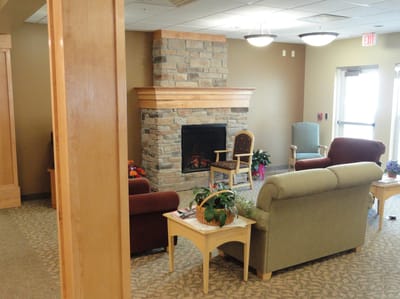 Cozy common area with seating and a fireplace