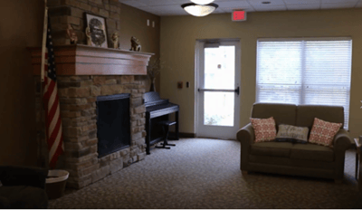 Cozy lounge area with a fireplace and seating