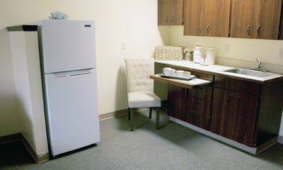Cozy kitchenette area in a private resident room