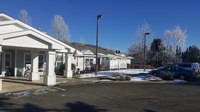 Exterior view of Applegate Place with snow and clear blue sky