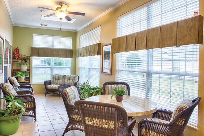 Bright common area with seating and plants