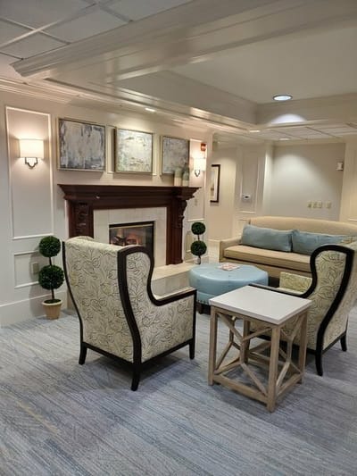 Cozy common area with seating and a fireplace