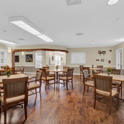 Dining area with wooden tables and chairs