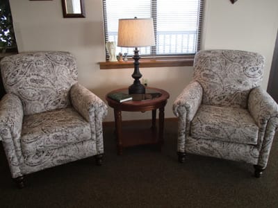 Cozy seating area with two armchairs and a lamp