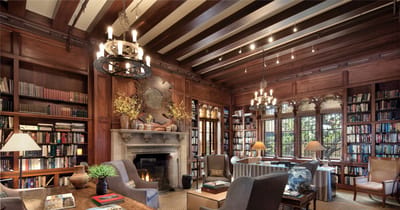 Cozy library with wooden beams and bookshelves