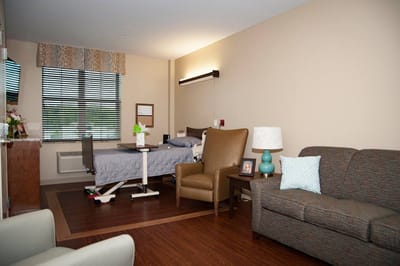 Cozy resident room with bed and seating area