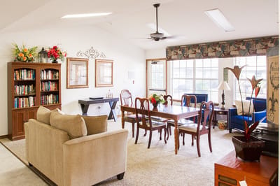 Bright common area with seating and bookshelves