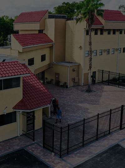 Exterior view of the facility with a gated entrance