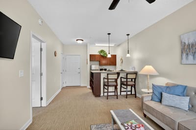 Bright interior view of a senior living unit with kitchen