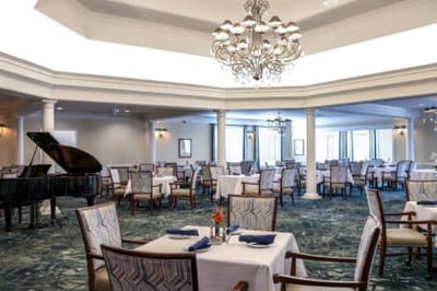 Interior dining room with tables and a piano