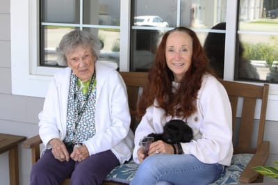 Residents enjoying time outdoors on a bench