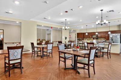 Dining room with tables arranged for residents