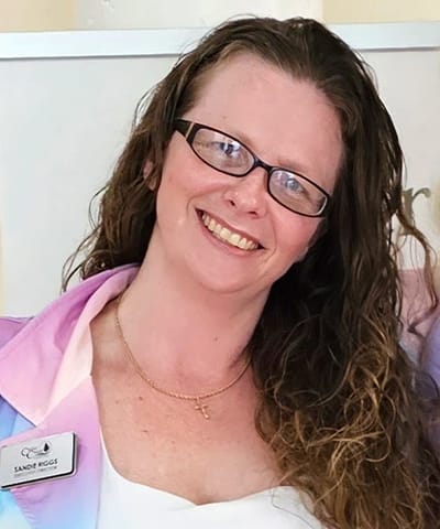 Staff member smiling in a professional setting