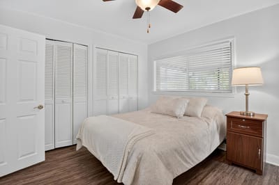 Cozy private bedroom with a bed and lamp