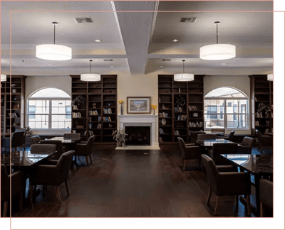 Interior common area with seating and bookshelves