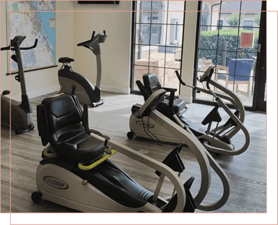 Exercise equipment in a bright fitness area