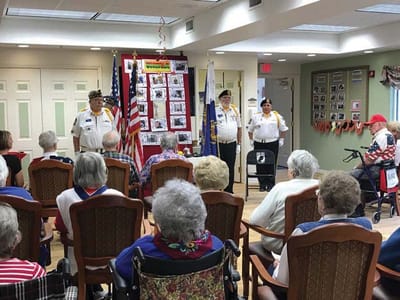 Residents enjoying a memorial event in a common area