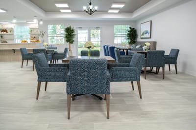 Bright common area with tables and seating