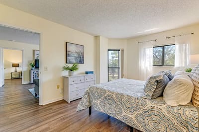 Bright interior of a resident room with a bed and decor