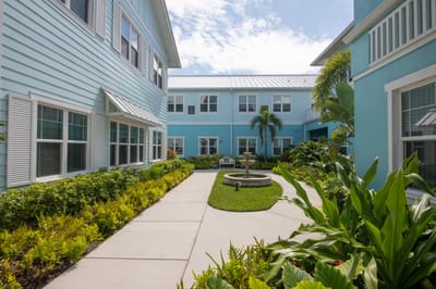 Well-maintained garden courtyard with pathways and fountain