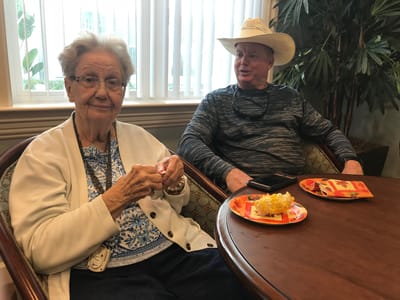 Residents enjoying snacks in a common area