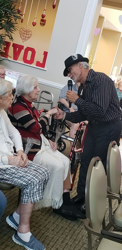 Residents enjoying a performance in a common area