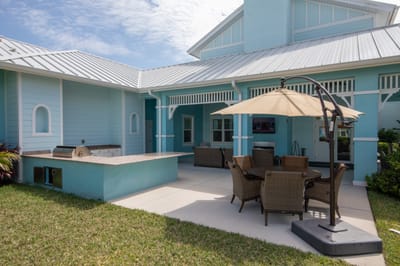 Outdoor seating area with furniture and umbrella