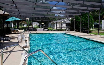 Swimming pool area with covered seating