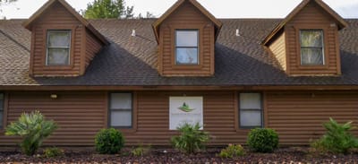 Exterior view of Homewood Lodge with branding