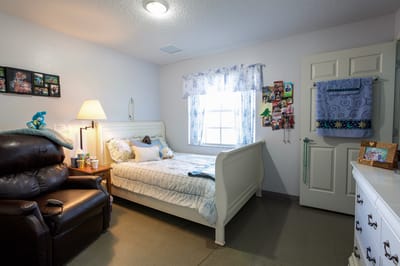 Cozy resident room with bed and seating area
