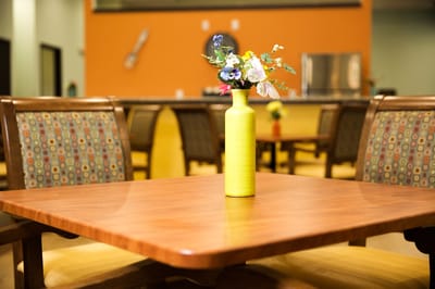 Table with a flower vase in a friendly dining area