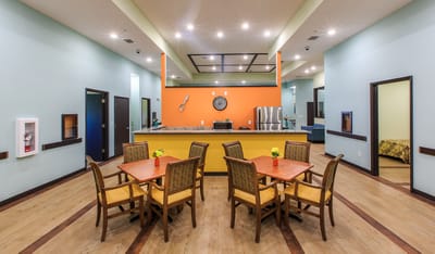 Bright dining area with tables and chairs