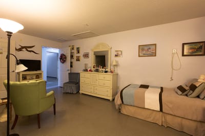 Interior view of a private resident room with furnishings