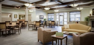 Bright common area with seating and tables