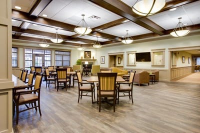 Bright common area with seating and tables
