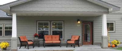 Exterior view of a welcoming porch with seating